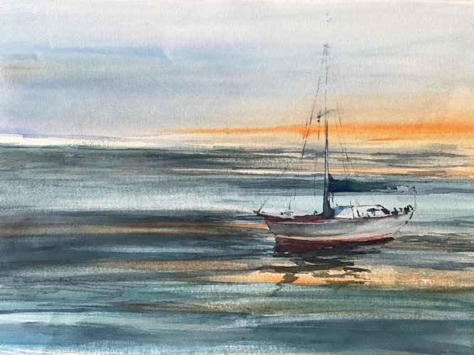 selgelboot im Sonnenuntergang bei ruhigem Wasser